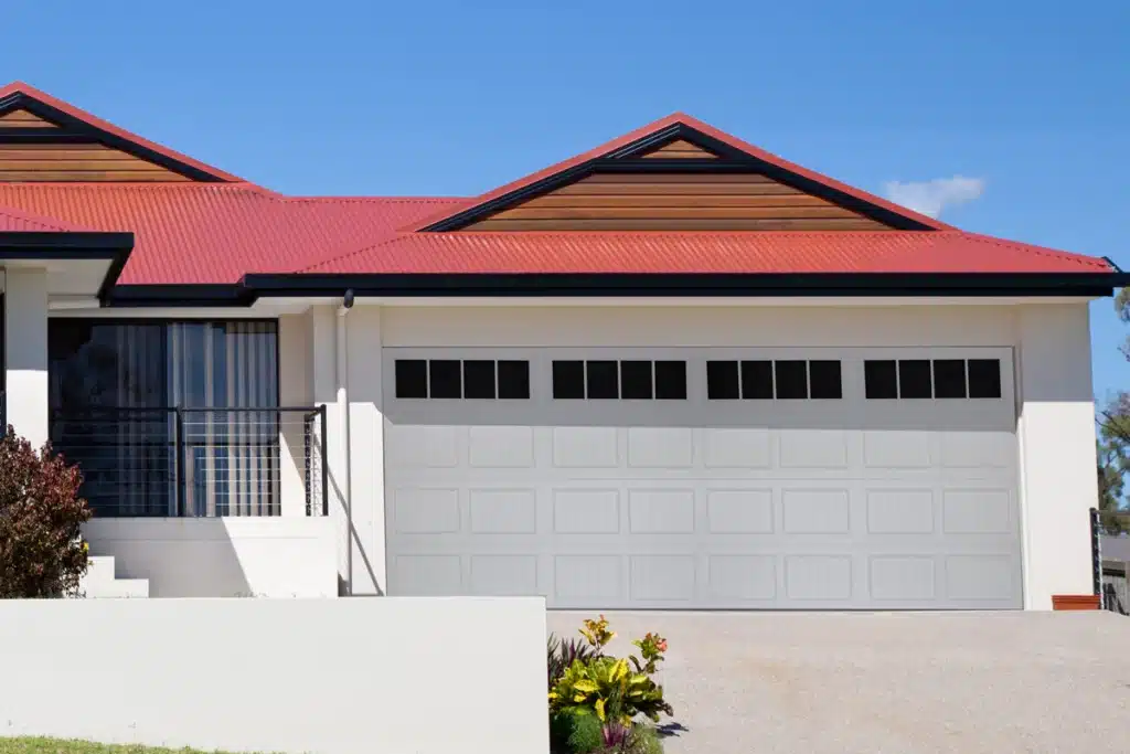 Carriage House Groved Panel Garage Doors On House