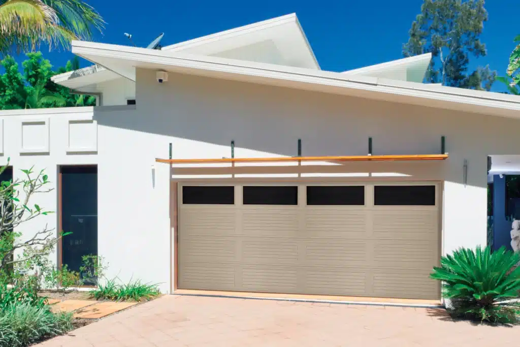 Louvered Panel Garage Door Model 460-461 on contemporary home